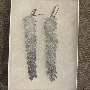 Beautiful silver metal cut feather earrings